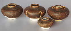 Chinese brown-glazed jarlets, height 7.5, 7.5, 4.5 and 7.5cm
