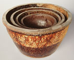 Chinese brown-glazed garden pots, perhaps from Guangdong, found in sets of two or four. Diameter 15, 17.5, 21 and 26cm.