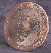 Lid with recessed lotus-bud handle from the 'Longquan' wreck;  diameter 10.5cm