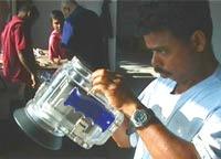 Preparing underwater video camera: Chandaratne, Nov 2001. Photo by Robert Parthesius.