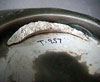 Celadon plate T-957 showing remains of tubular support stuck to the base.