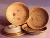 Photo of saucers with lumps of red stacking clay