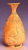 Photo of peacock vase with vertical striations.
