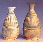 Photo of bottle-vases with vertical striations.
